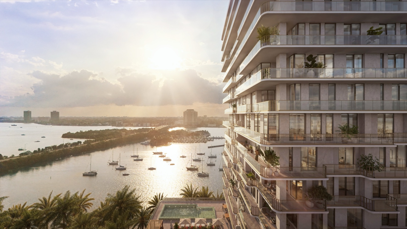 Tula Residences — 21-story boutique waterfront tower in North Bay Village, Miami, viewed from Biscayne Bay at dusk.